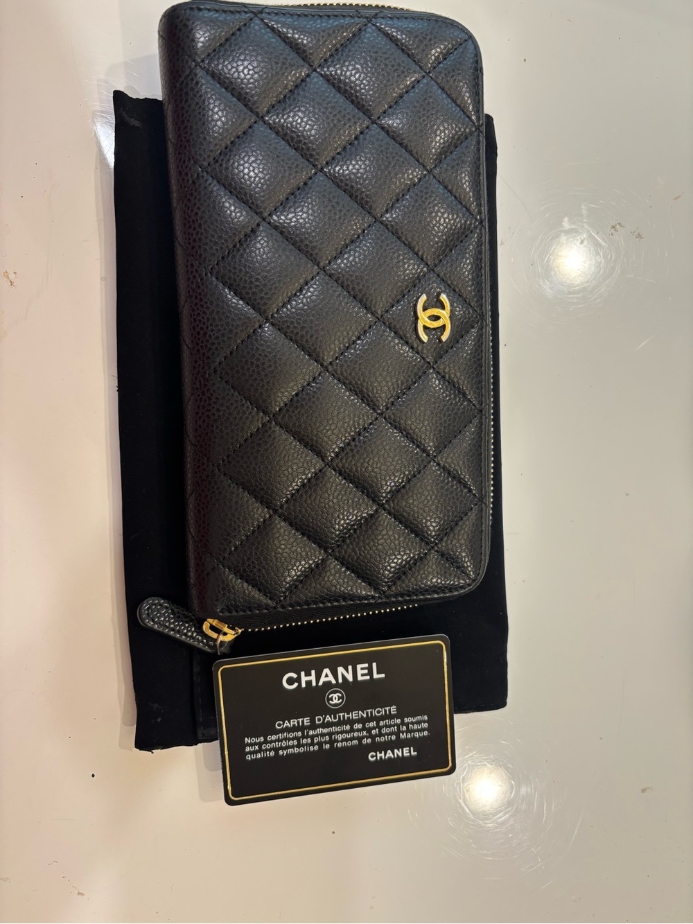CHANEL Black Quilted Zip-Around Wallet with Gold CC
